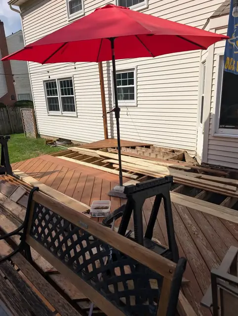 A weathered backyard deck before restoration